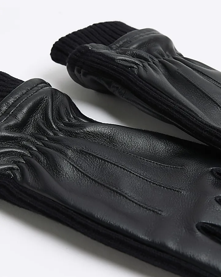 Black leather gloves